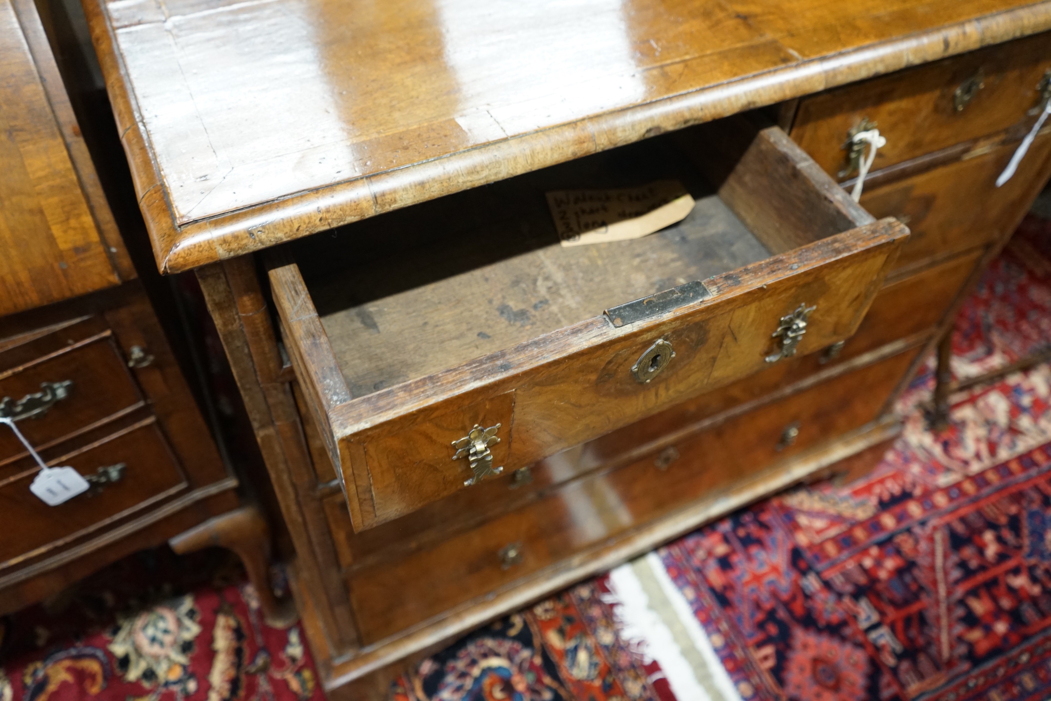 An 18th century feather banded walnut chest of two short and three long drawers, width 95cm, depth 58cm, height 92cm